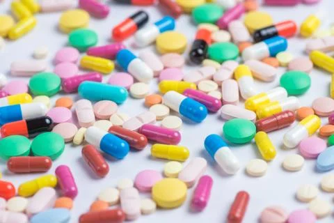 Tablets and pills on a white background Stock Photos