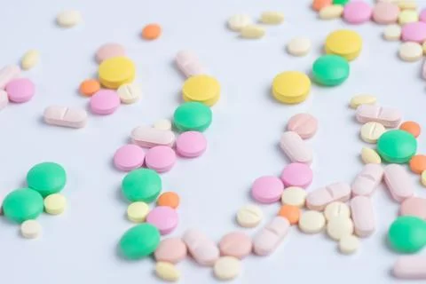 Tablets and pills on a white background Stock Photos