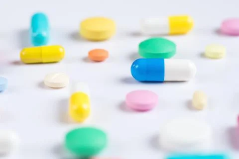 Tablets and pills on a white background Stock Photos