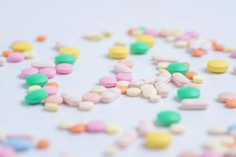 Tablets and pills on a white background Stock Photos