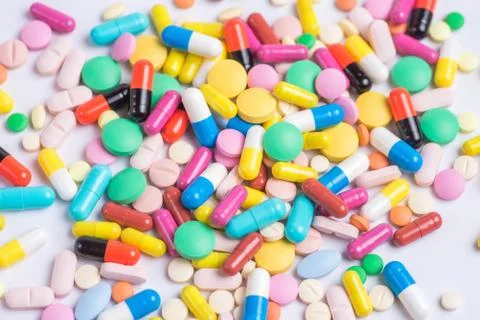 Tablets and pills on a white background Stock Photos