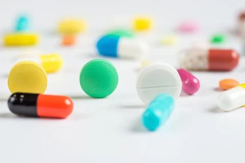 Tablets and pills on a white background Stock Photos