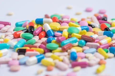 Tablets and pills on a white background Stock Photos