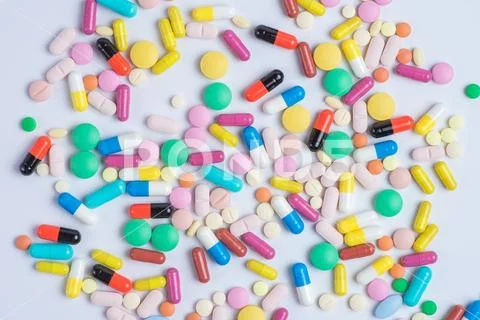 Tablets and pills on a white background Stock Photos