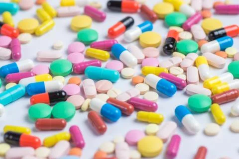 Tablets and pills on a white background Stock Photos