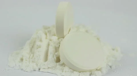 Tablets and the powder on a white background macro closeup rotation. Video stock 54922462