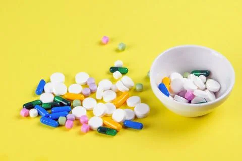 Tablets are scattered on the table, dosage for the patient Stock Photos