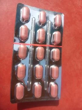 Tablets are solid, oral dosage forms of medication. Stock Photos