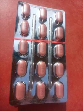 Tablets are solid, oral dosage forms of medication. Stock Photos