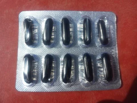 Tablets are solid, oral dosage forms of medication. Stock Photos
