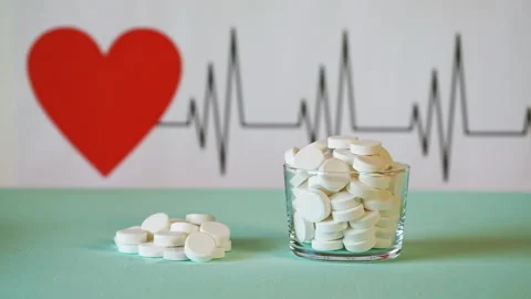 Tablets on the background of the cardiogram of the heart Stock Footage 107229621