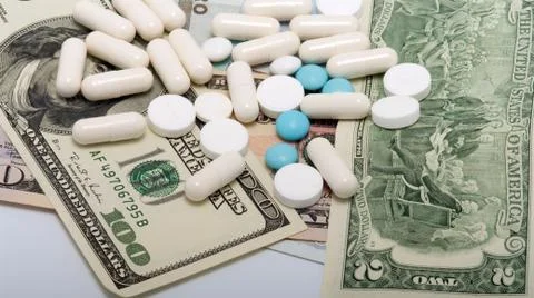 Tablets on banknotes. Stock Photos