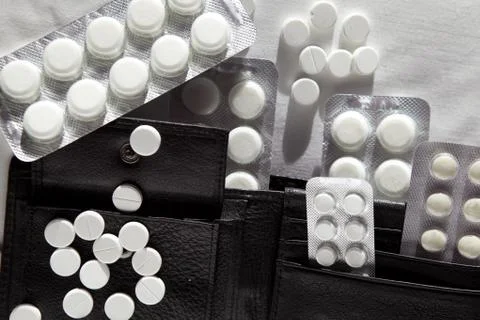 Tablets in a black purse Stock Photos