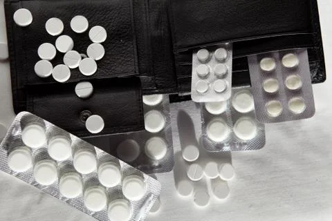 Tablets in a black purse Foto stock