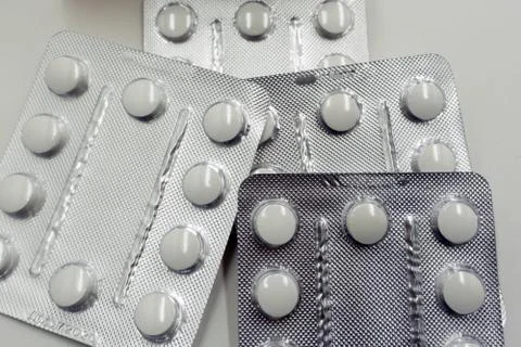 Tablets in blisters on a white background . Stock Photos
