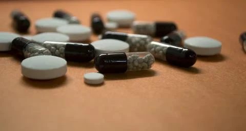 Tablets, capsules are on the table Stock Photos