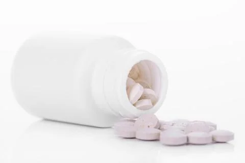 Tablets with container Stock Photos