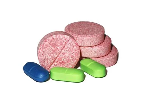Tablets of different colors isolated on a white background. Stock Photos