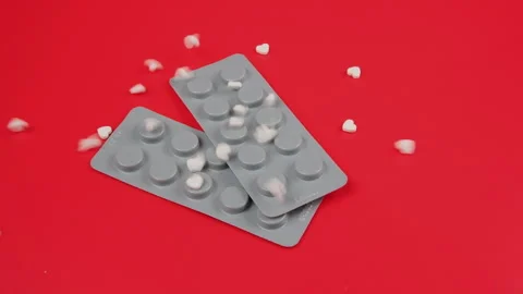 Tablets fall out of the bottle onto the table, slow motion. Antiviral drugs, vir Stock Footage 277548395