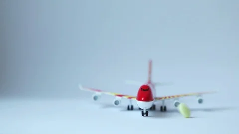 Tablets falling on a model airplane.  Stock Footage 109071508