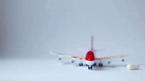 Tablets falling on a model airplane.  Stock Footage 109071537