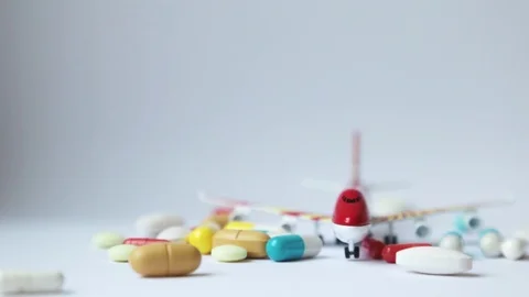 Tablets falling on a model airplane.  Stock Footage 109071543