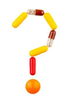 Tablets in the form of a question mark Foto stock