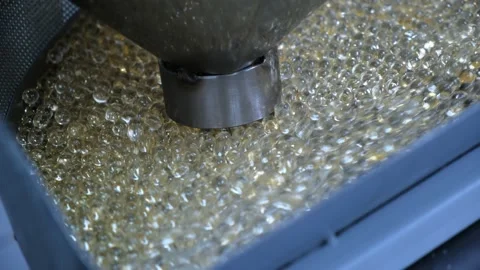 Tablets in a gelatinous shell close-up. Production of medicinal products Stock Footage 171935568