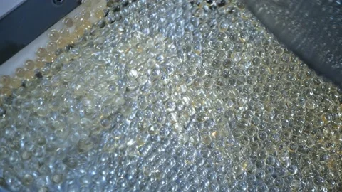 Tablets in a gelatinous shell close-up. Production of medicinal products Stock Footage 171935630