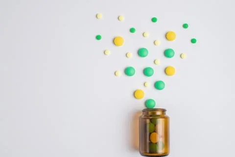 Tablets  in the glass bottle on a white background Stock Photos