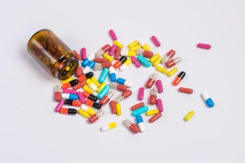 Tablets  in the glass bottle on a white background Stock Photos