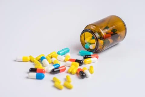 Tablets  in the glass bottle on a white background Stock Photos