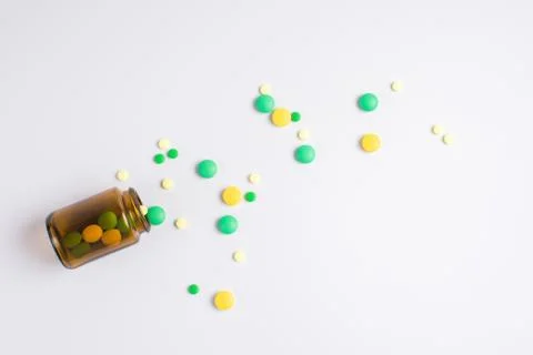 Tablets  in the glass bottle on a white background Stock Photos