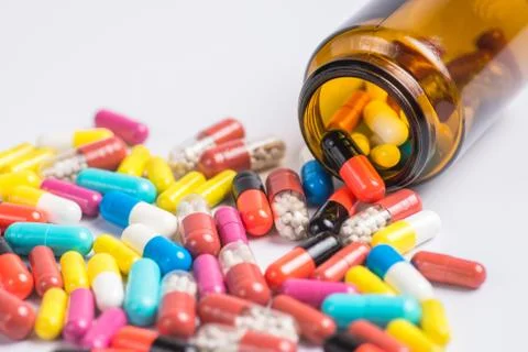 Tablets  in the glass bottle on a white background Stock Photos