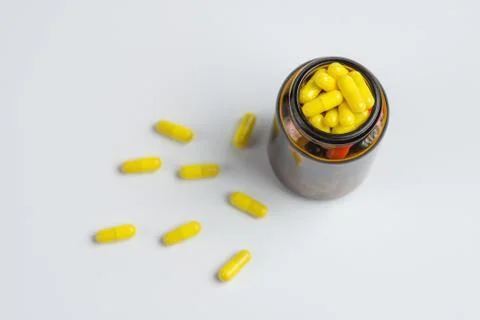 Tablets  in the glass bottle on a white background Stock Photos