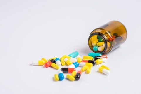Tablets  in the glass bottle on a white background Stock Photos