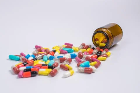 Tablets  in the glass bottle on a white background Stock Photos