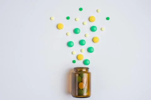 Tablets  in the glass bottle on a white background Stock Photos