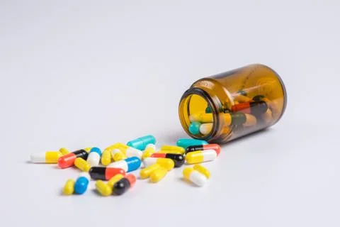 Tablets  in the glass bottle on a white background Stock Photos