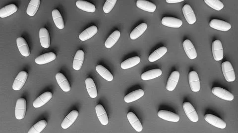 Tablets on grey background. Monochrome simple flat lay with pastel texture Stock Photos