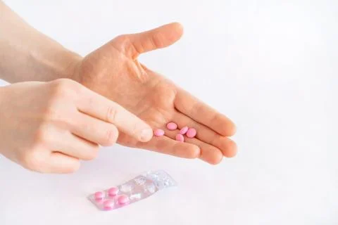 Tablets in hand on a white background close-up. Foto stock