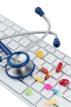 Tablets on keyboard Stock Photos