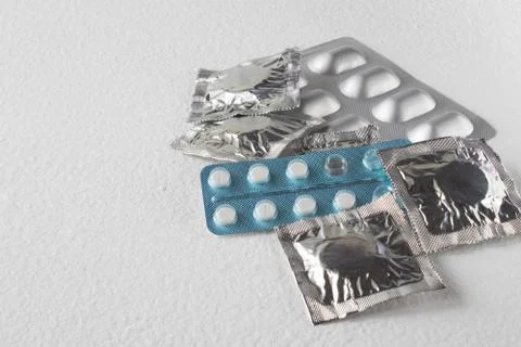 Tablets on a light background. Different types of pills. Closed pills in pack Stock Photos