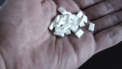 Tablets, medications in hand Stock Footage 73546391