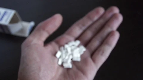 Tablets, medications in hand Stock Footage 73546588