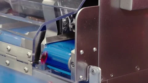 The tablets move on the conveyor belt . the close-up of pharma production. Stock Footage 199684381