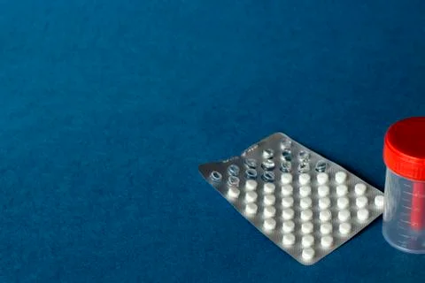 Tablets in the package are on a blue background Stock Photos