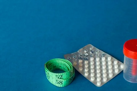 Tablets in the package are on a blue background Stock Photos