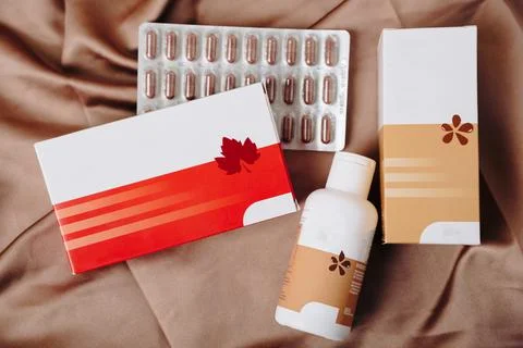 Tablets with packaging close-up on a colored background Foto stock