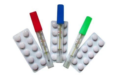 Tablets in plates for improving vision and thermometers Stock Photos
